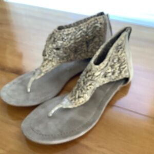 All leather tan sandals with soft woven leather uppers, zippered back.